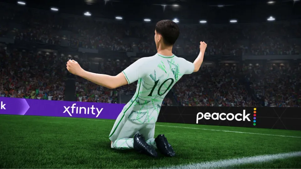 A player celebrates in front of Xfinity and Peacock perimeter boards in EA SPORTS FC